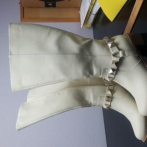 Tall off white boots in vegan leather with zipper and 2" heels. Never used.